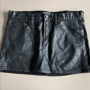 Agolde black vegan leather denim skirt.